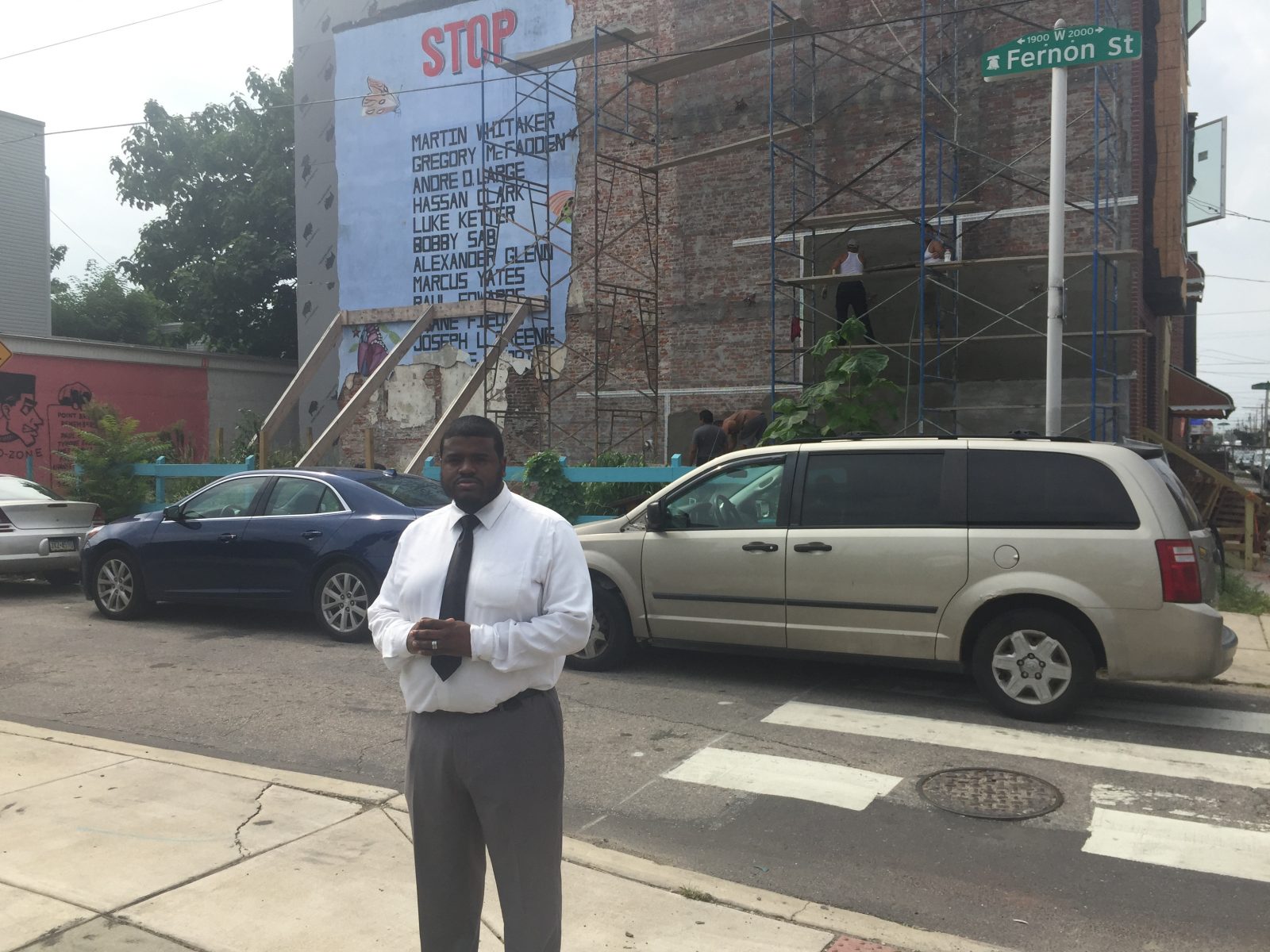Darryl Roberts walks past the mural often. His cousin, Marcus Yates, was killed in the crossfire of a gunfight 30 years ago. | Annette John-Hall/WHYY News