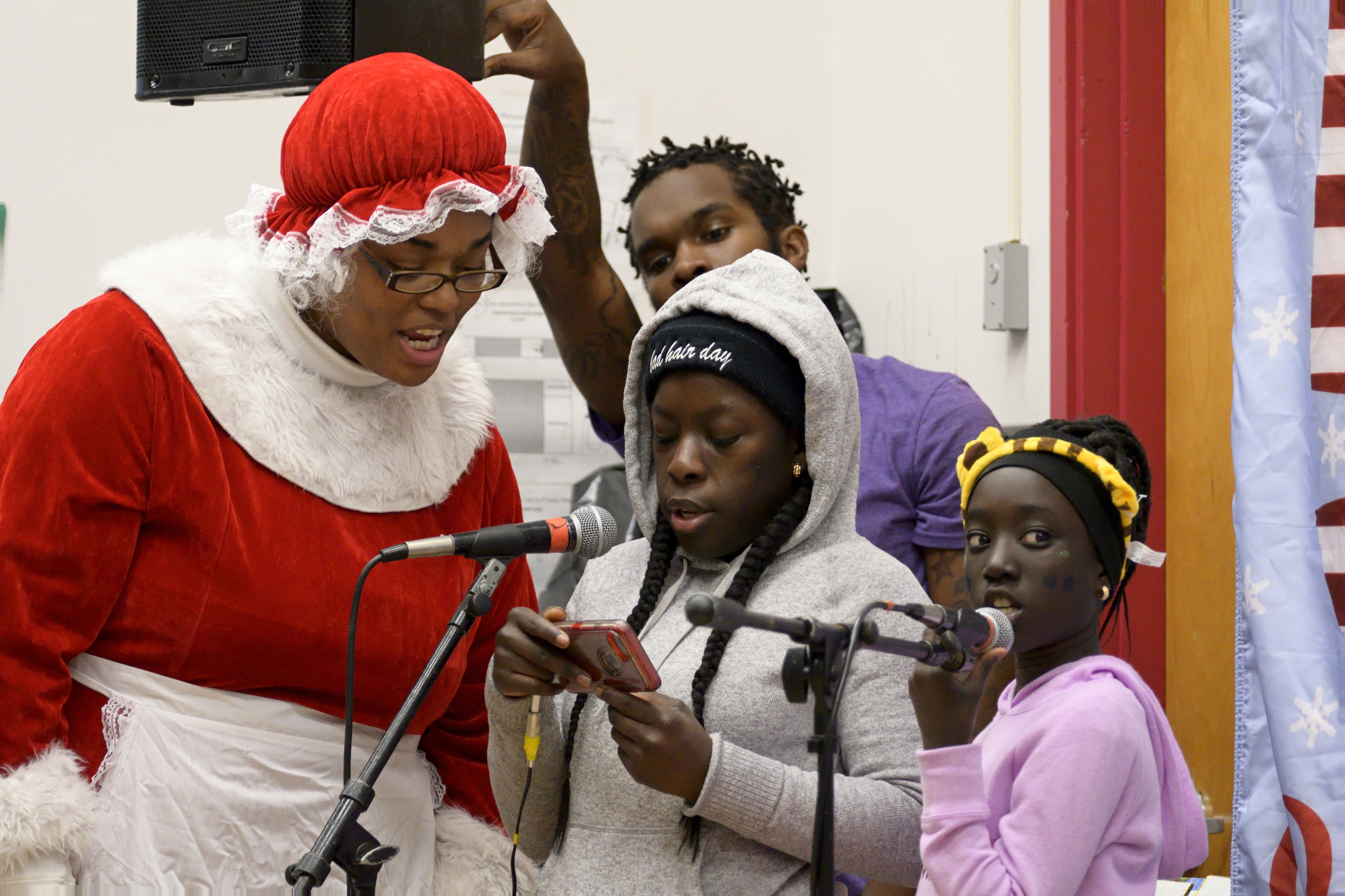 Singing along with Mrs. Clause at the Annual Winter Festival in Olney. Bas Slabbers/WHYY.