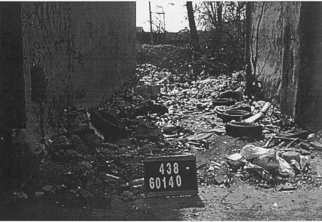 An abandoned, rubble-filled lot squeezed between two empty homes on W. Norris in the late 1990s.