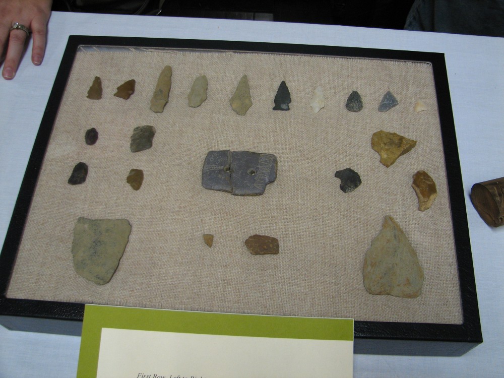A selection of Native American tools and an amulet found near I-95