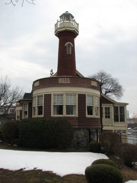 The beacon at the western end of the row, Boathouse #15, was built by Arthur H. Brockie for the Sedgeley Club in 1902.