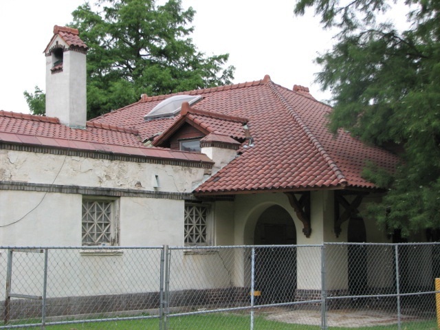 The Spanish tiles, pitched roofs, arches and small windows distinguish the MIssion-style building from those on Boathouse Row.