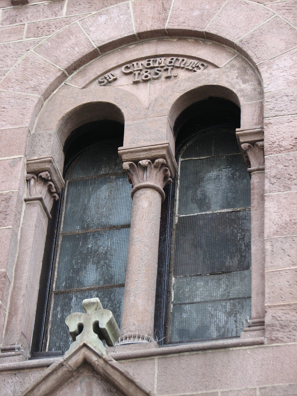 St. Clement's arched windows characterize the Romanesque Revival style. 