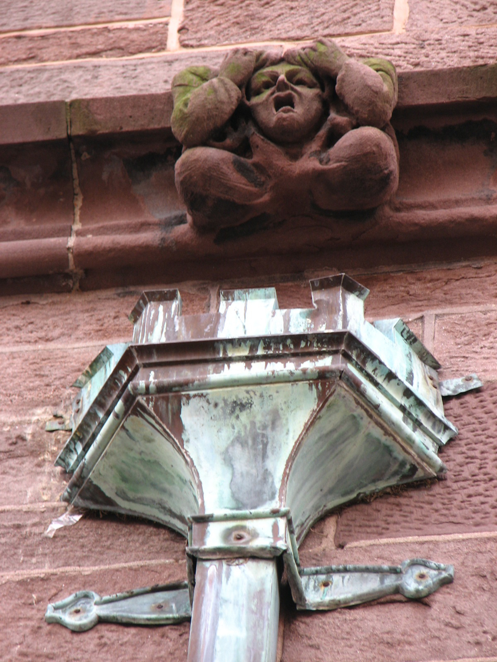 Gargoyles and ornate downspouts adorn the north side of St. Clement's. 