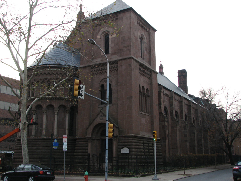 The view of the northeast corner of St. Clement's Episcopal Church, dominated by the bell tower and apse.
