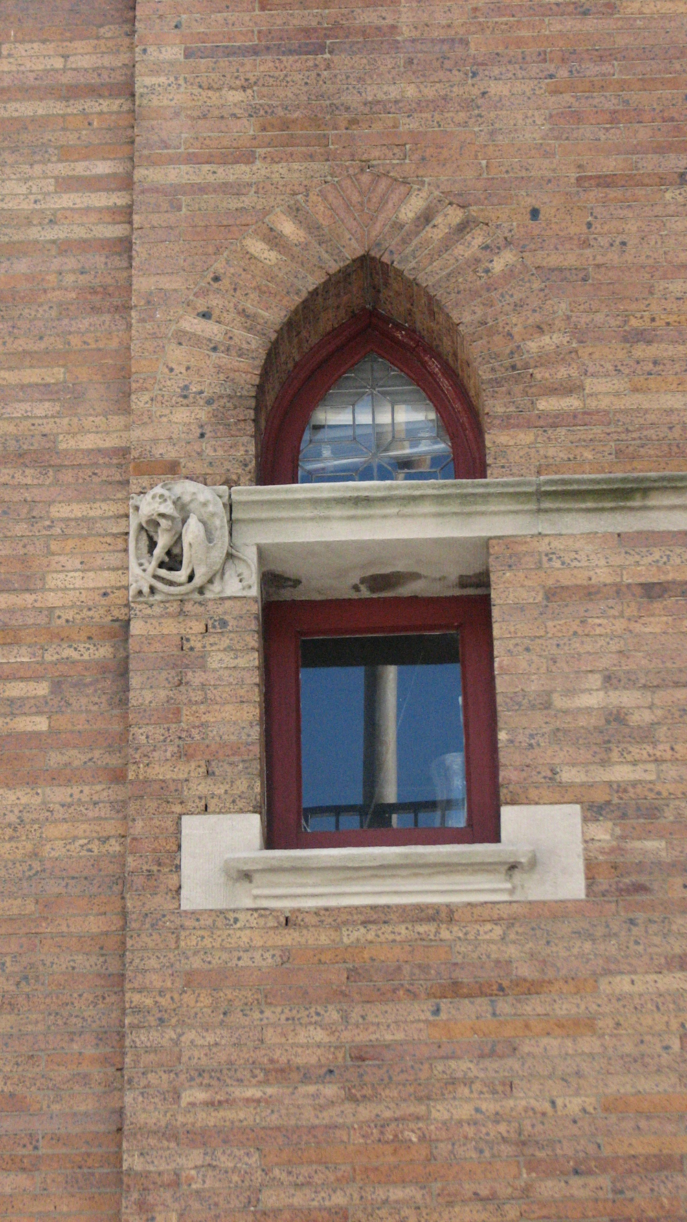 Pointed Gothic windows and carvings adorn the Moore House.