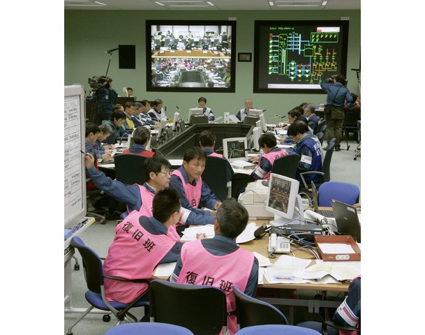 Staff at Tokyo Electric Power Co.'s Fukushima Daiichi Nuclear Power Plant practice countermeasures for a nuclear emergency