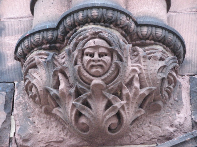 Grimacing and smiling faces adorn the main entrance.