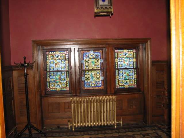Original interior features, including stained-glass windows, have been preserved.