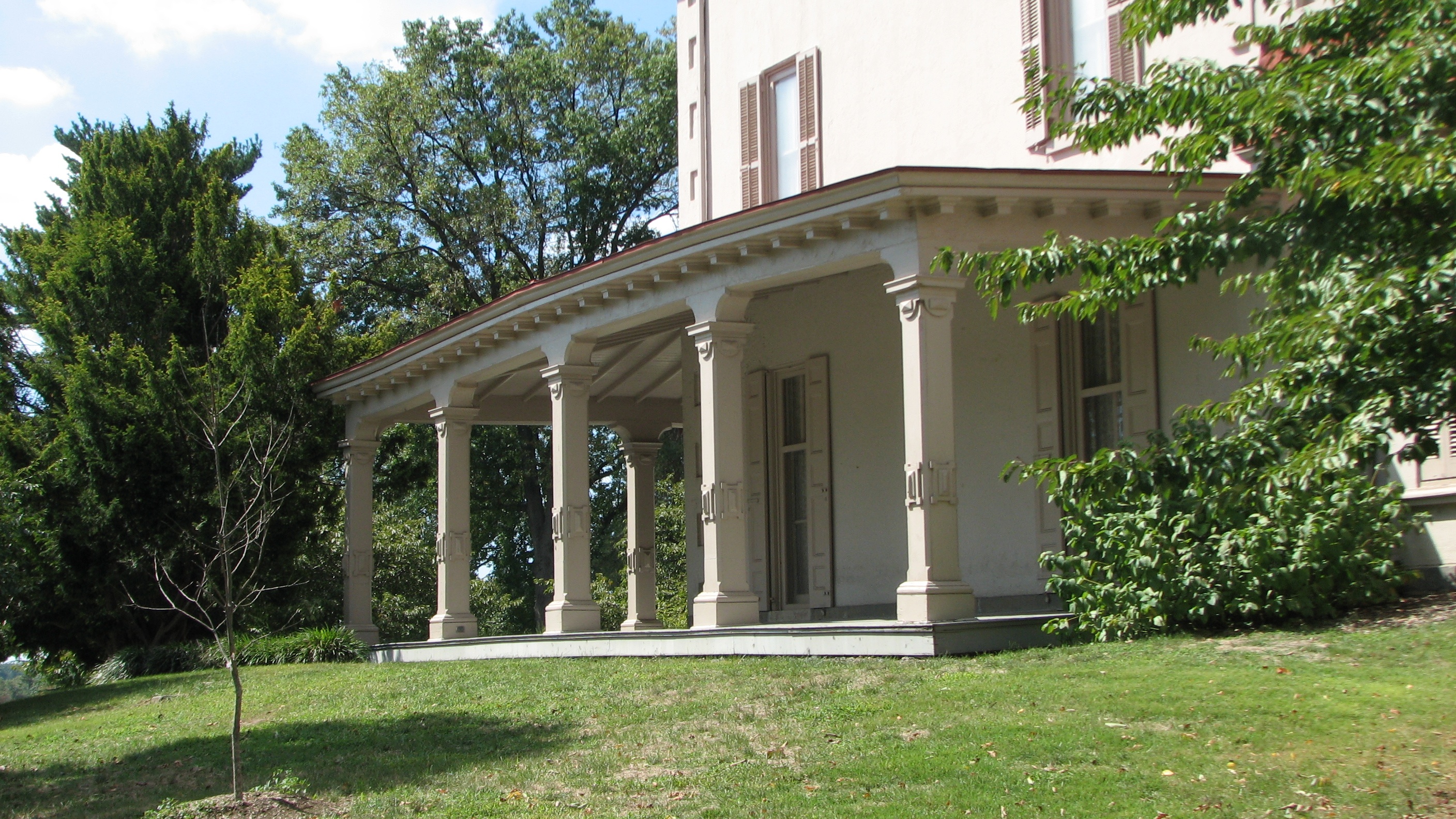 A grand veranda wraps around the Ryerss mansion.