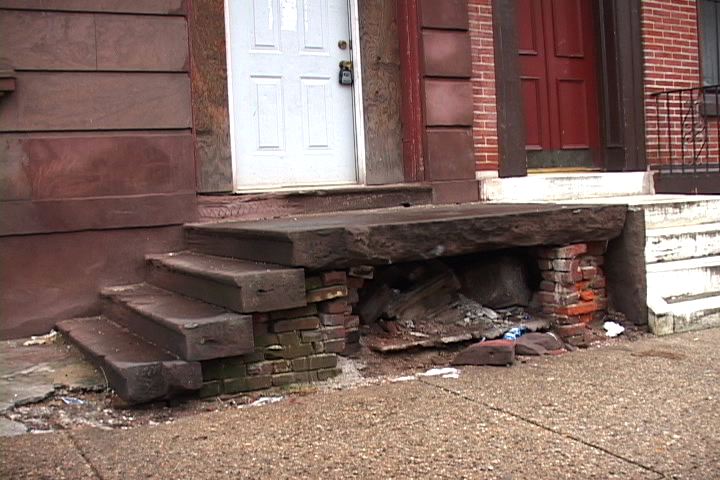 The front steps on aging row homes like this one in Francisville can be problematic and dangerous for people with mobility issue