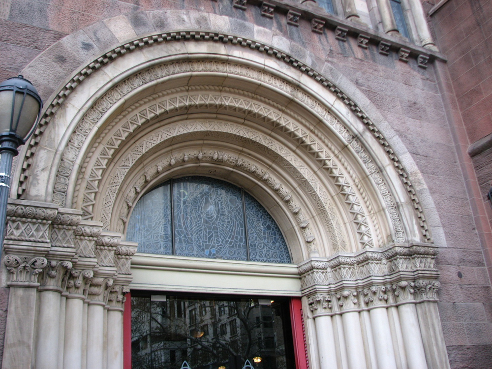 Holy Trinity's recessed arches are carved in geometric and foliate designs.