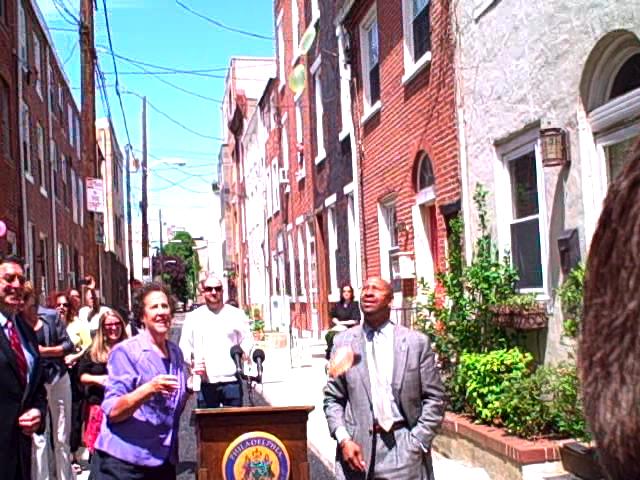 Mayor Nutter and city officials throw water balloons to showcase the porous street.