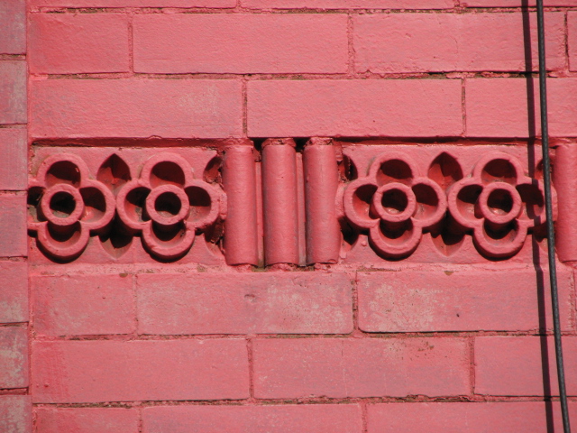  A variety of decorative terra-cotta designs are found on the walls of the Rowan Street houses