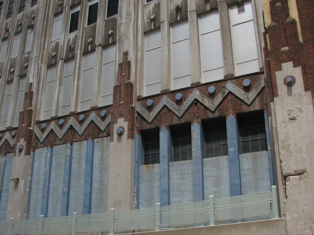 On the Noble Street side, the Lasher building shows off its raised chevrons and circles.