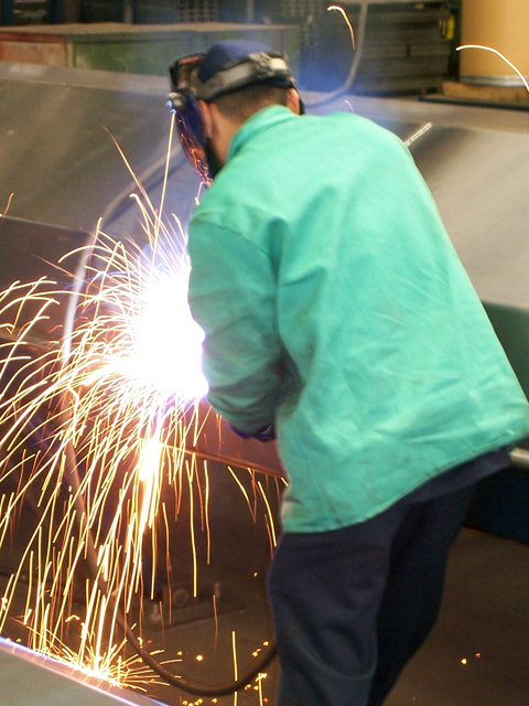 A welder at PTR Baler & Compactor Co., April 2010