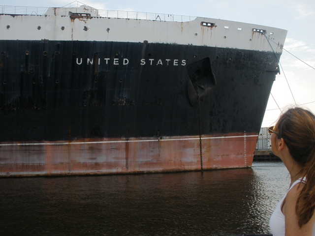 Susan Gibbs, Conservancy Board President and granddaughter of William Francis Gibbs, looks up at the bow of the SS United States