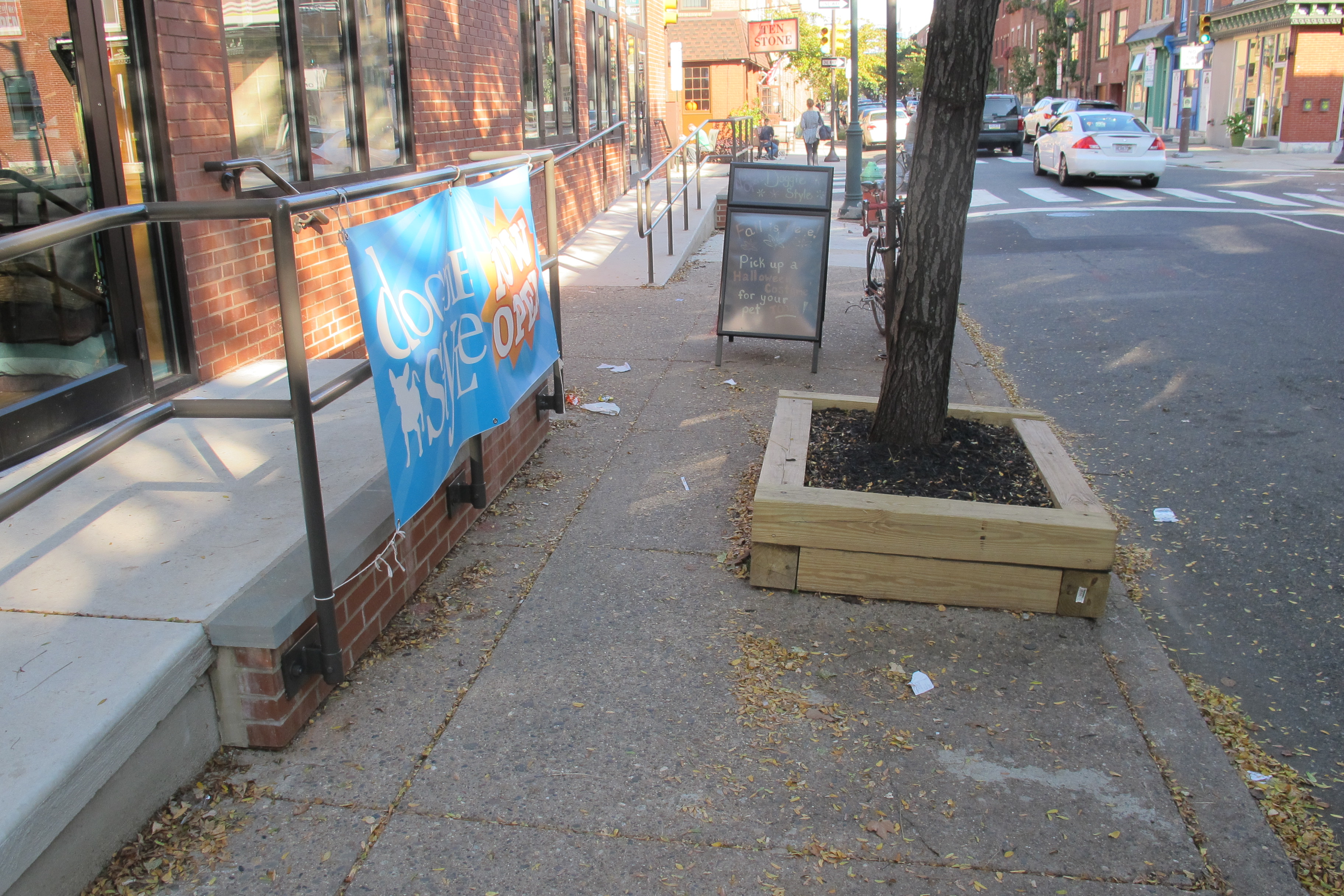 Between the new ramp and the street tree, the sidewalk becomes about 3 feet wide.