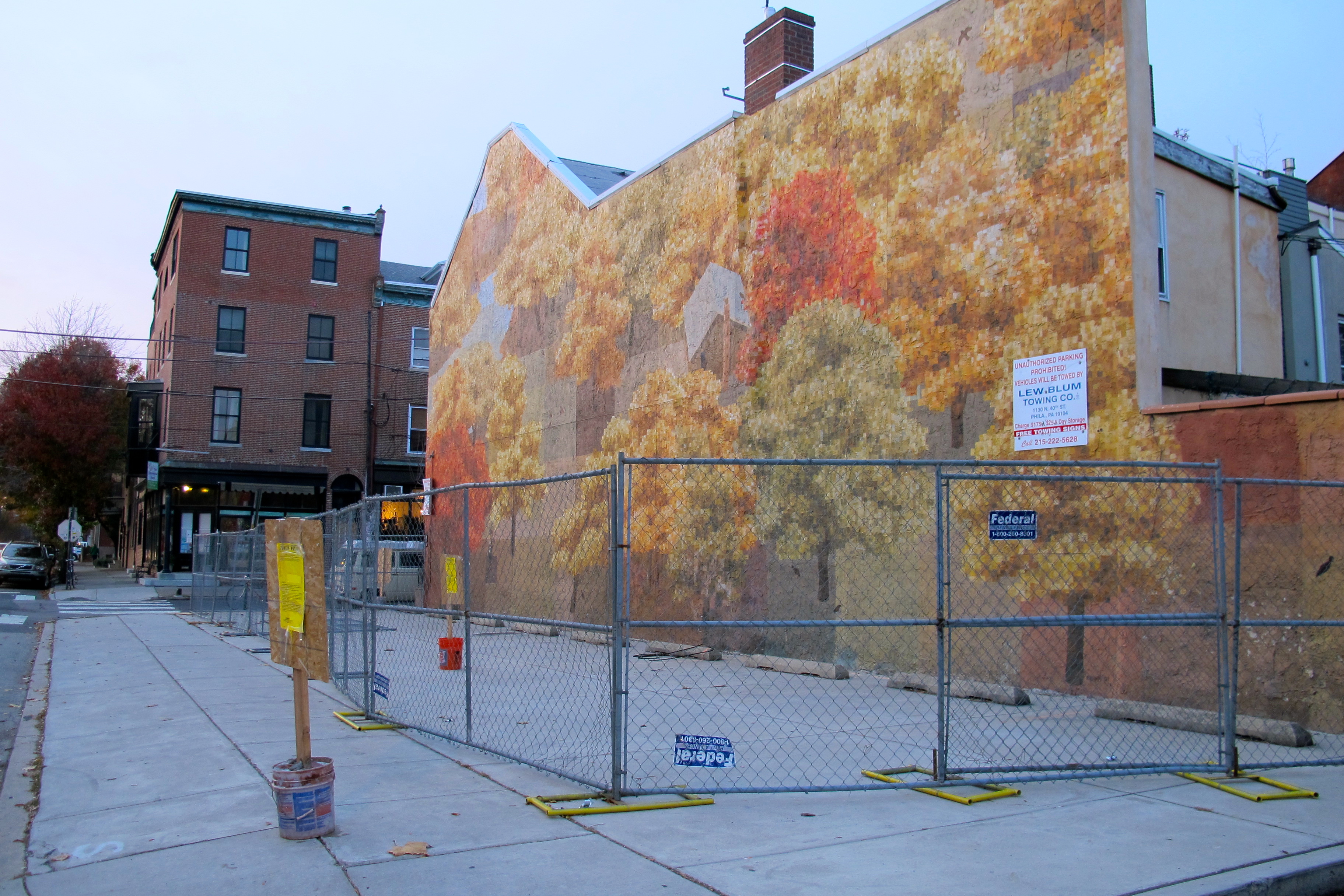 David Guinn's mural at 9th and Bainbridge gets fenced.