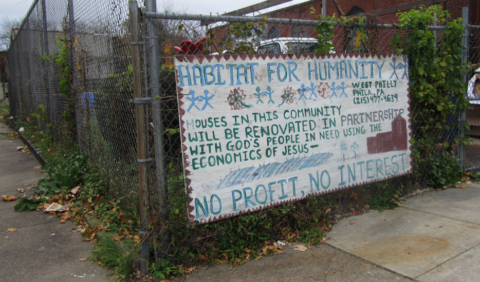 A sign near the LEED-certified row homes on West Stiles Street states Habitat for Humanity's commitment to sustainable development in Parkside. | Philadelphia Neighborhoods