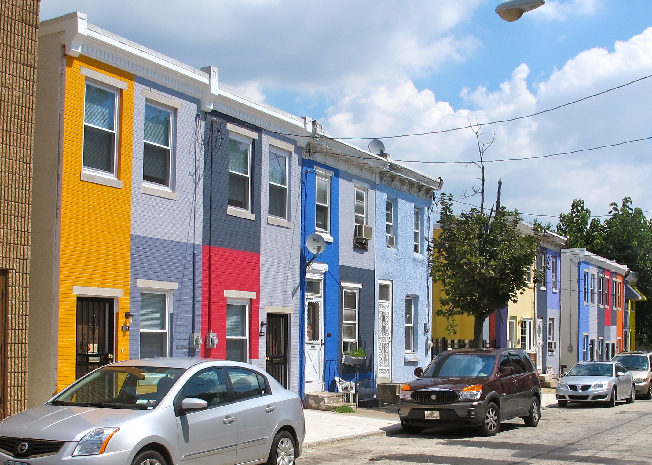 As part of its project A Place to Call Home, the Mural Arts Project painted the facades of the more than 30 homes on the 3800 block of Melon Street.