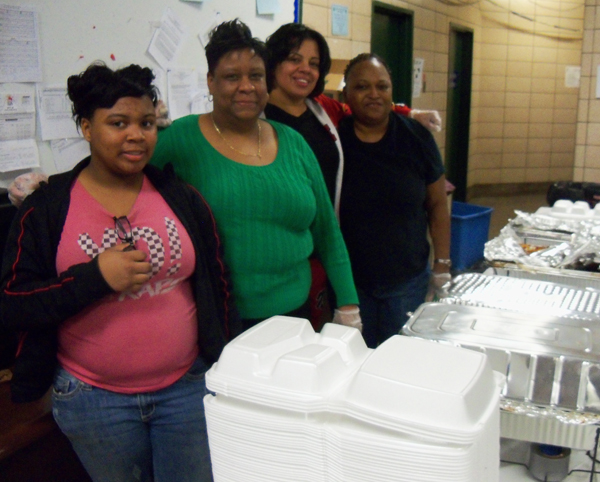 (L-R) Fatima Pickens, 19th district police officer Tina Jeter, Hollie Coleman and Marilyn Garner served chili and rice to the people at the Helping Hands Project. | Connor Showalter