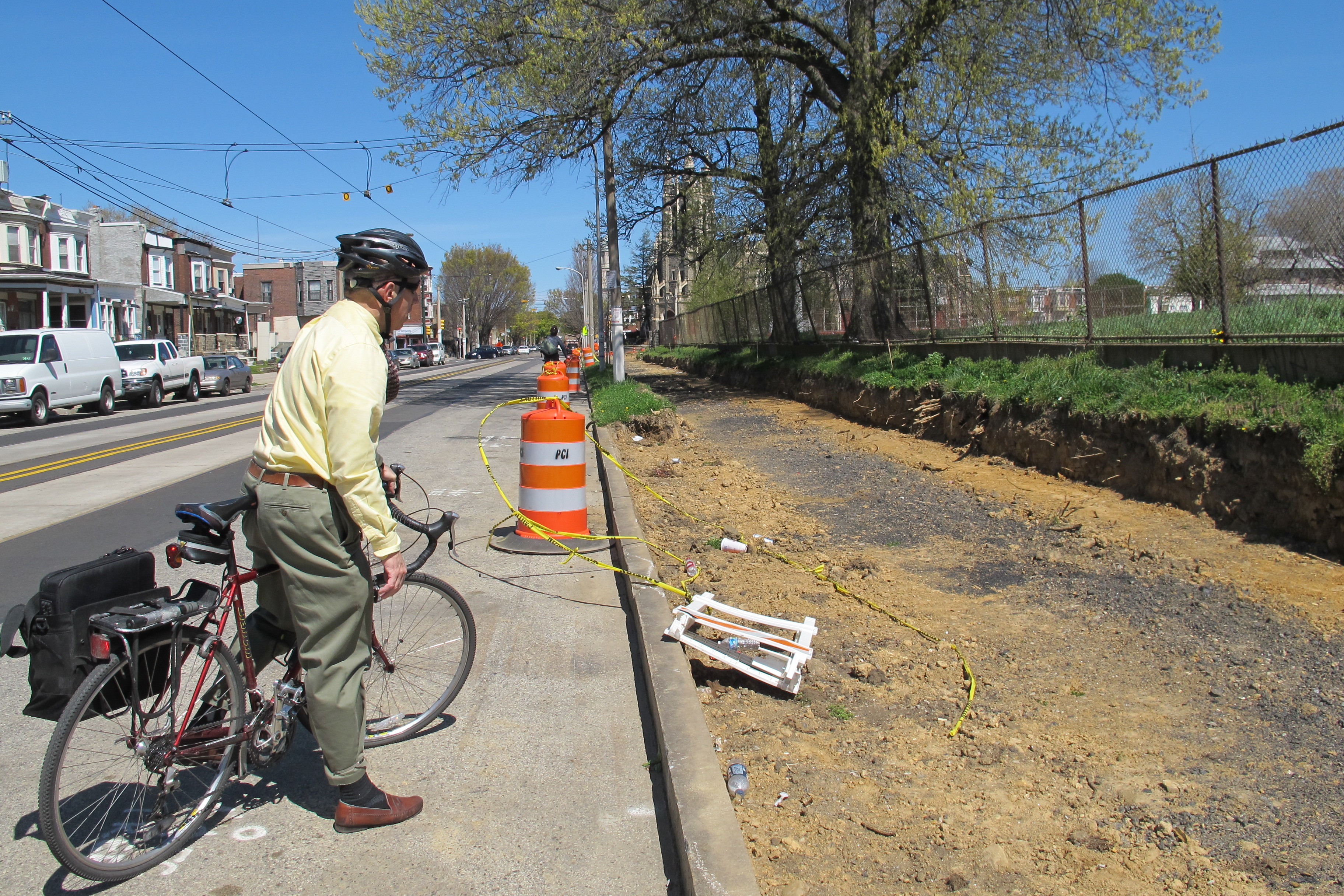 Charles looking at the greenway under construction along Chester Avenue.
