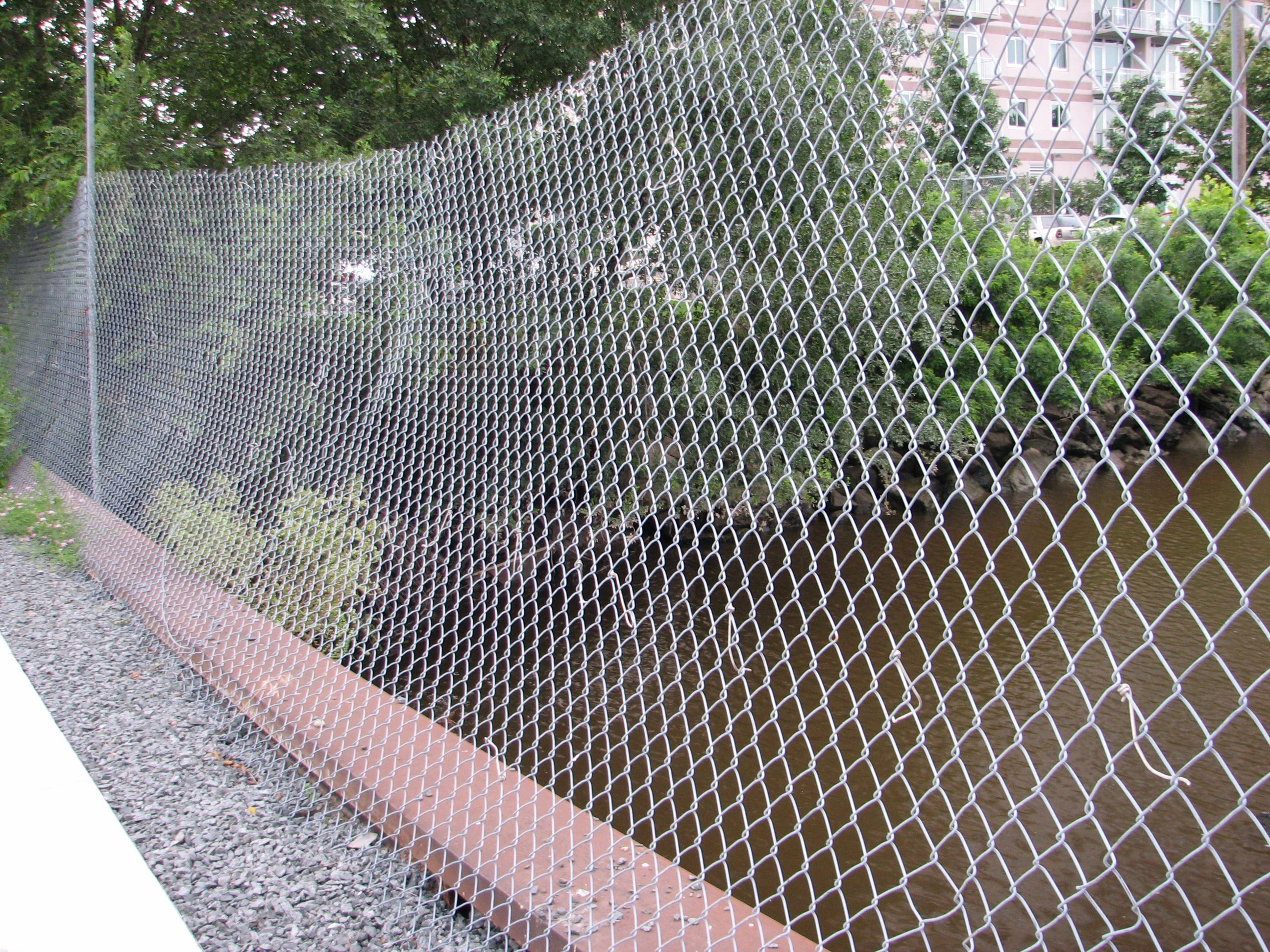 A loose chainlink fence along an inlet