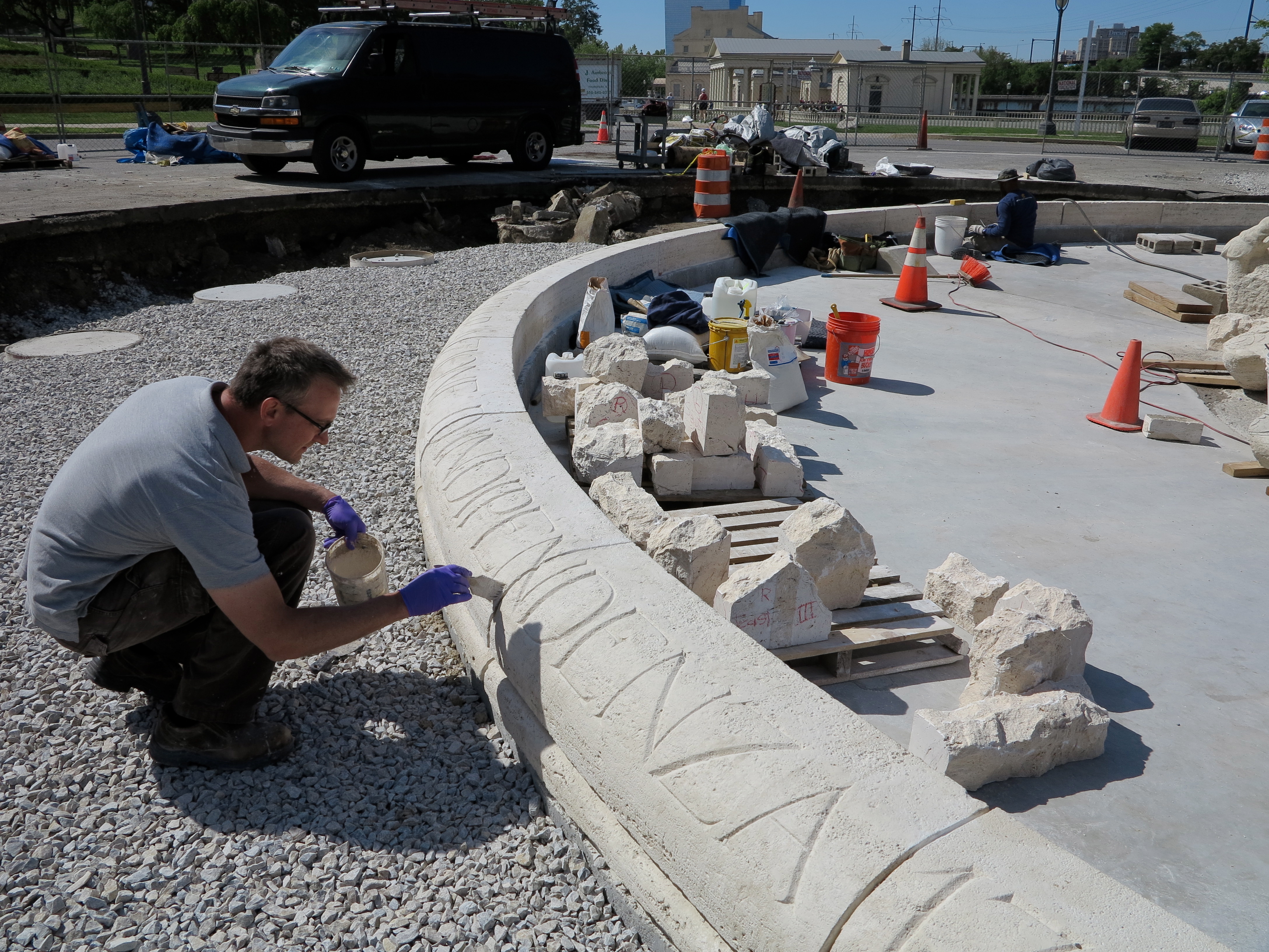 Conservation technician Lee Dunsmore working on the basin's copingstones. 
