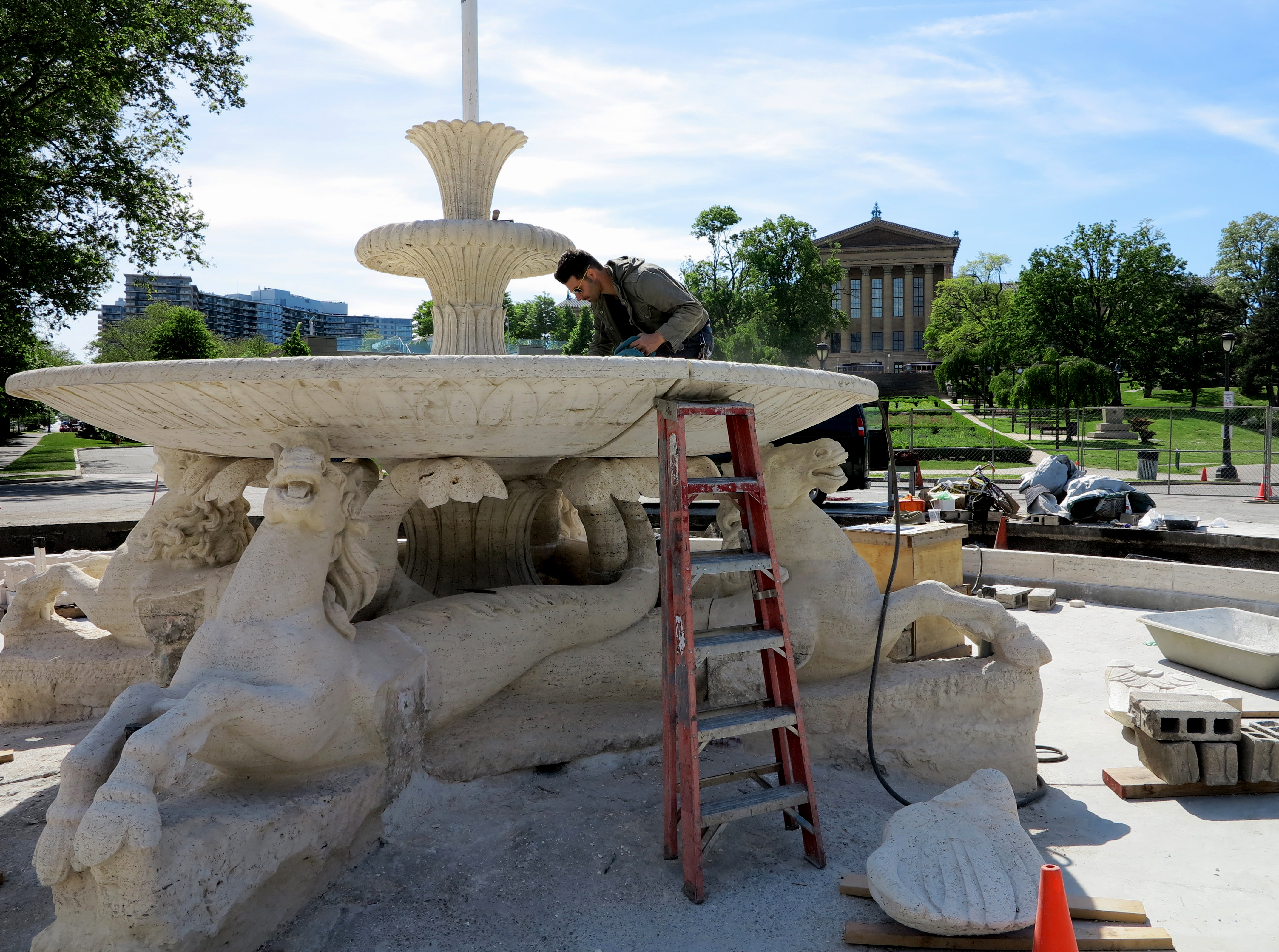 Conservator Marco Federico working in the fountain's shallow bowl.
