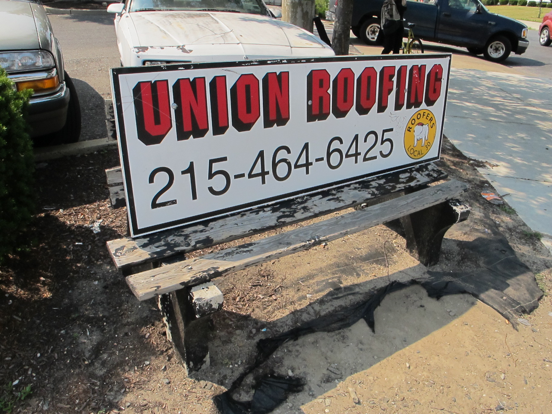Decrepit Union Roofing bench on Aramingo Ave, June 2012. (removed)