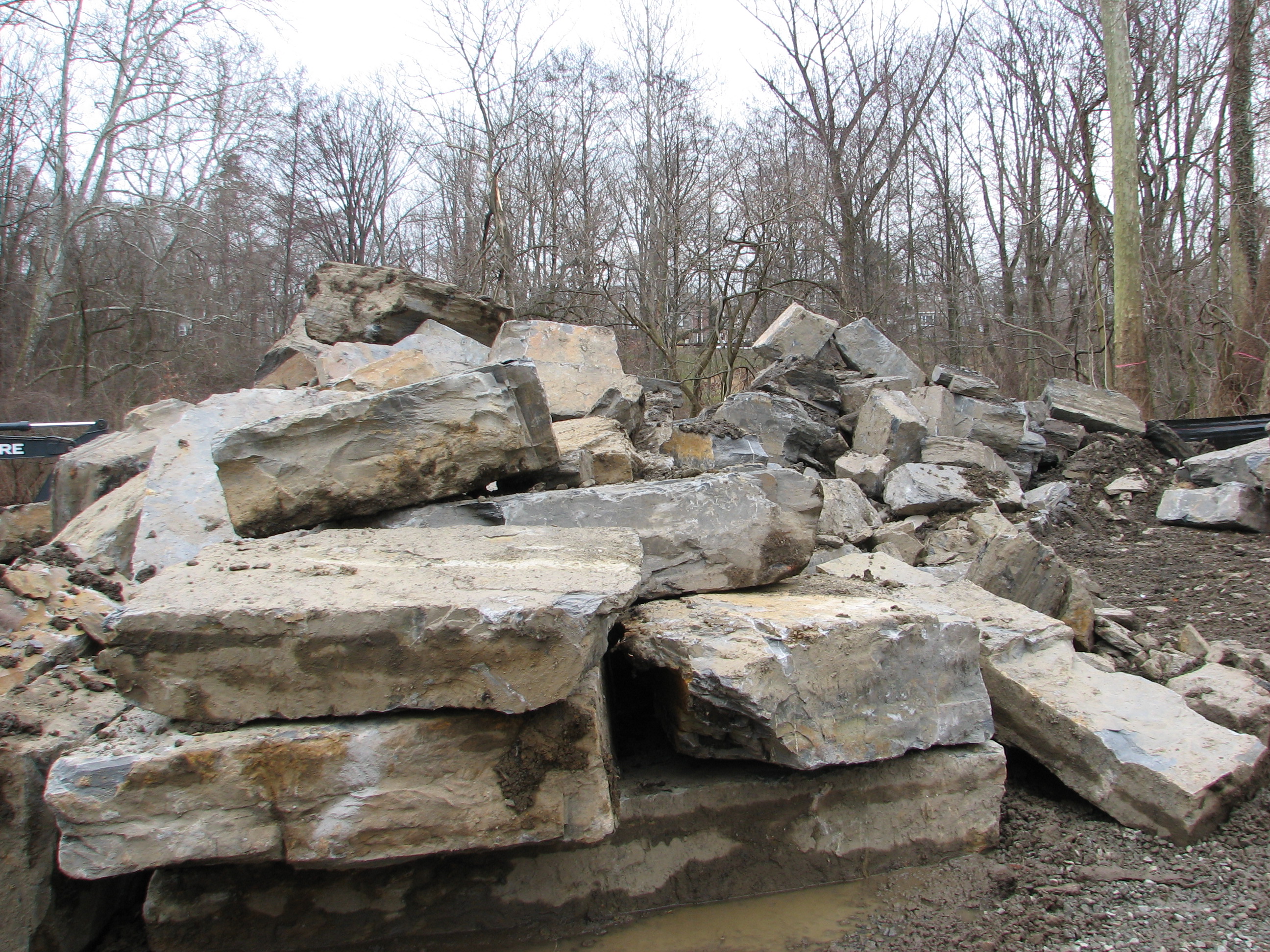 Large rocks that will be used to create a structure designed to prevent bank erosion at the new confluence of the east and west branches.
