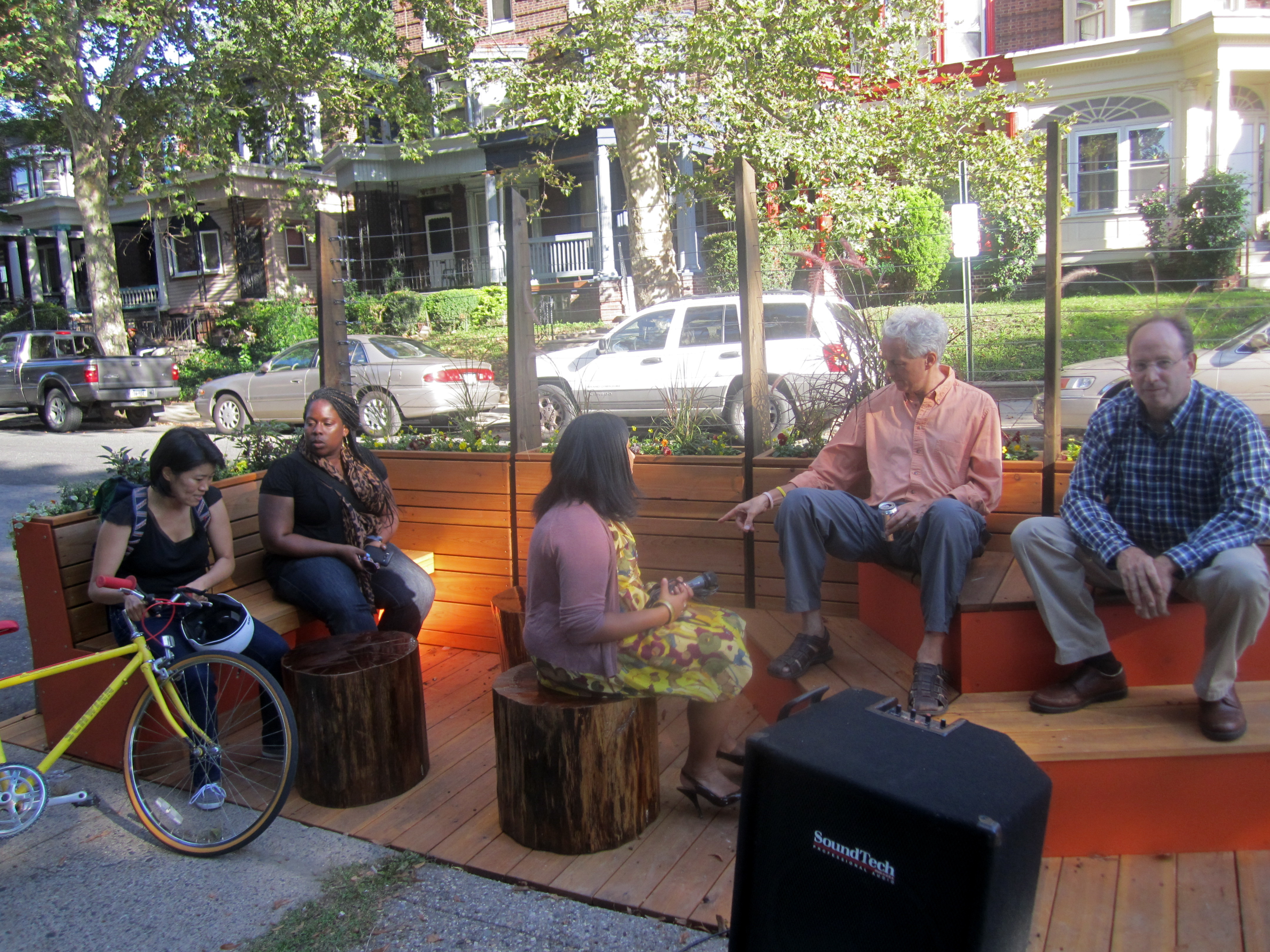 Some of the Logan parklet's first visitors used the various seating options in the lounge area.