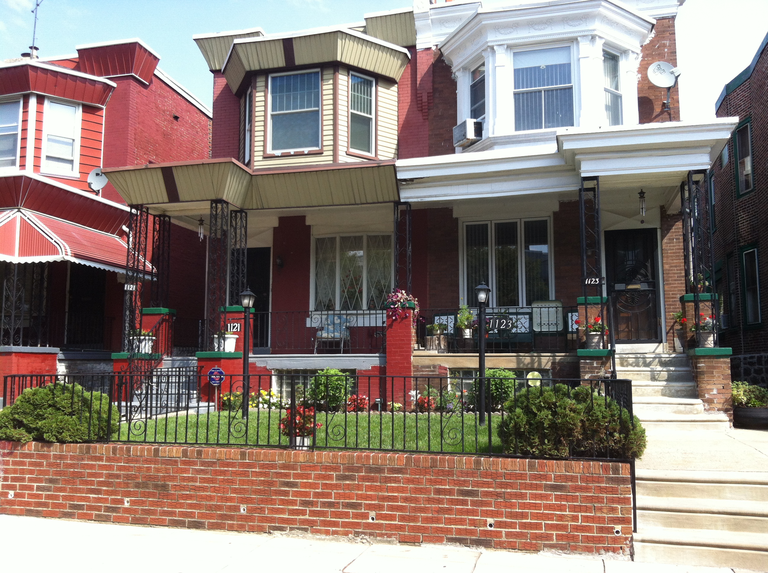 The 1100 block of S. Wilton Street in Kingsessing has tidy twins with well-kept front yards and spotless sidewalks.