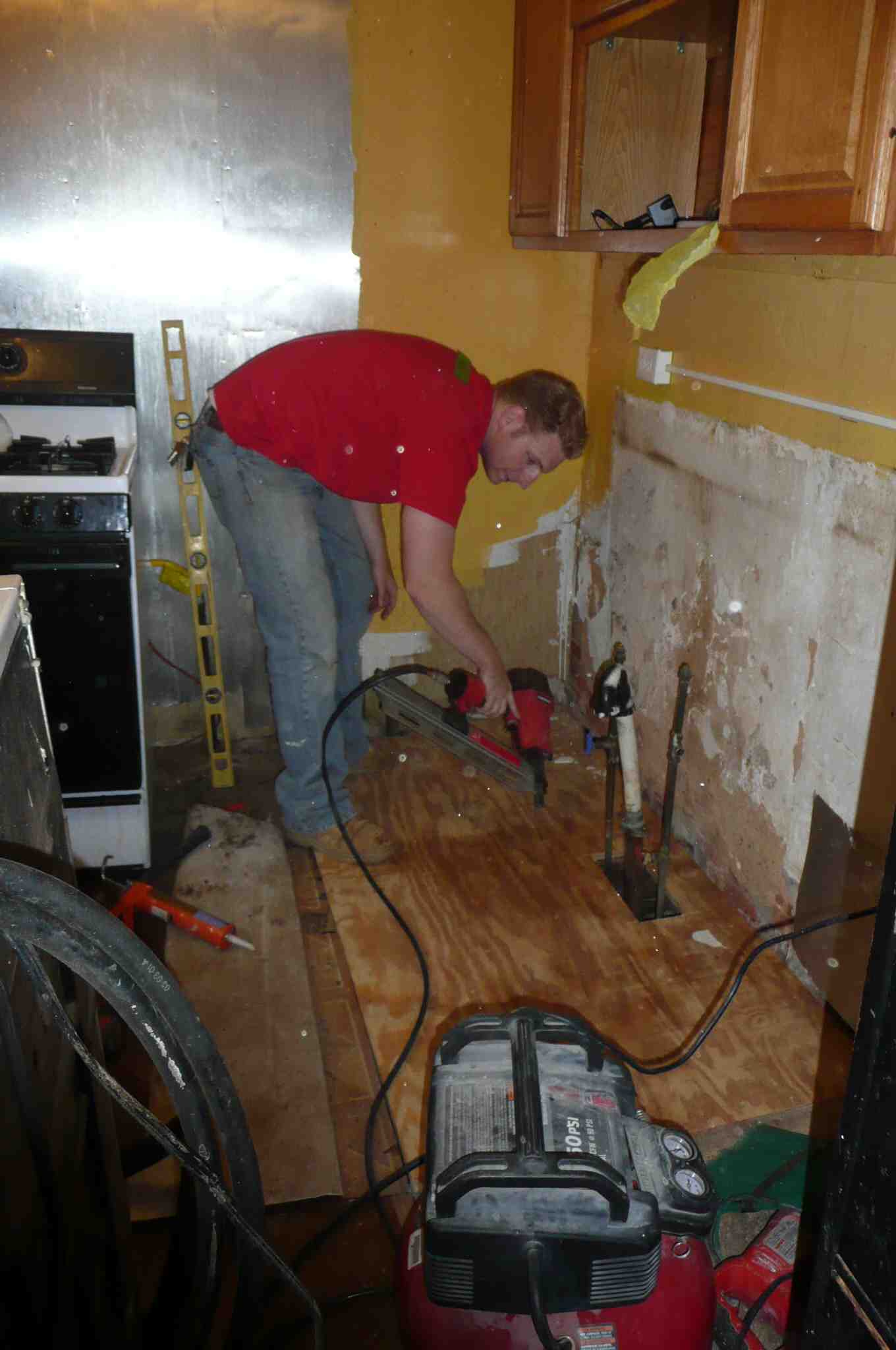 A Rebuilding Together volunteer worked on renovating a homeowner’s kitchen. | Philadelphia Neighborhoods