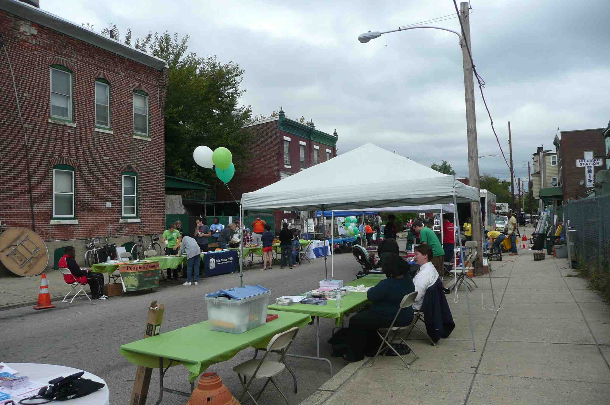 Volunteers and organizers lined Holly Street with information tables. | Philadelphia Neighborhoods