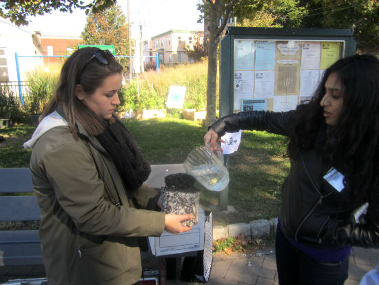 Before the scavenger hunt, Madeline Bell and Aisha Malika from the Fairmount Water Works Interpretive Center demonstrated how water can flow through porous pavement