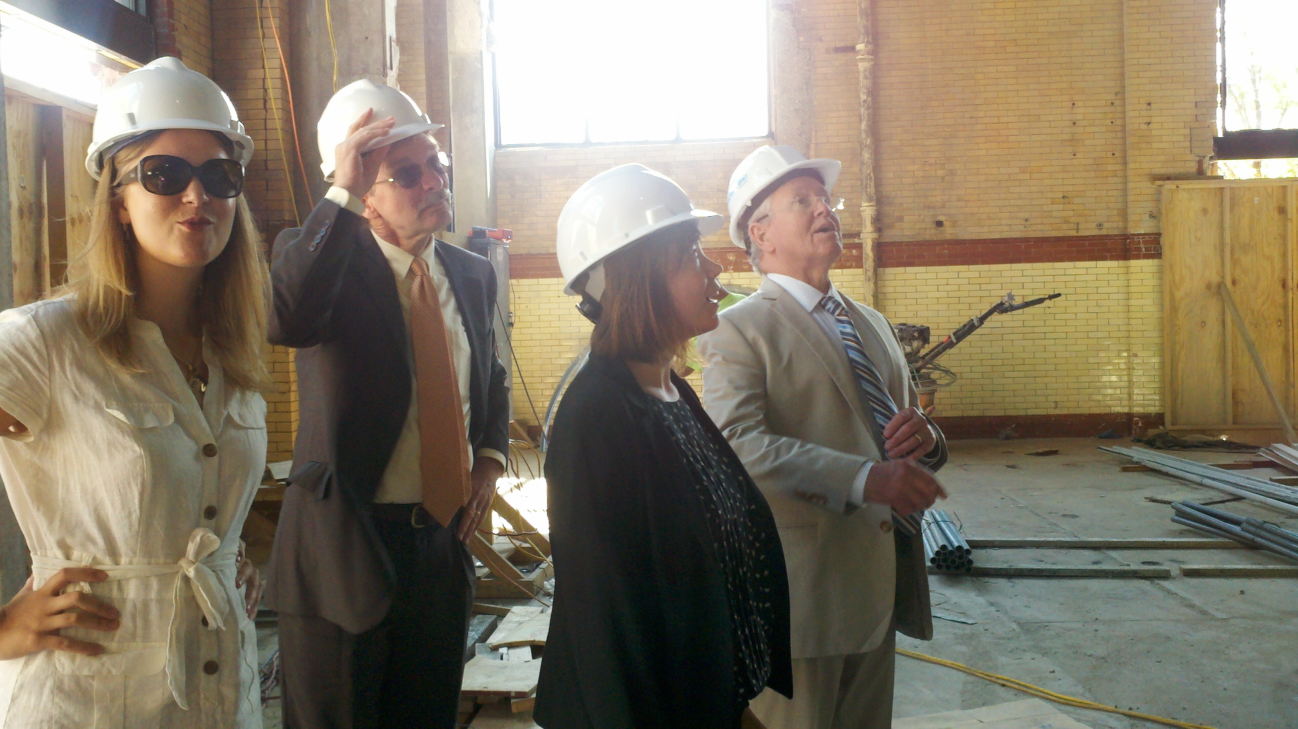 Philadelphia City Planning Commission Executive Director Gary Jastrzab - the man in back with his hand on his hard hat - joins DRWC Planners Lizzie Woods (next to Jastrzab) and Karen Thompson and DRWC President Tom Corcoran on a tour of the FringeArts building.