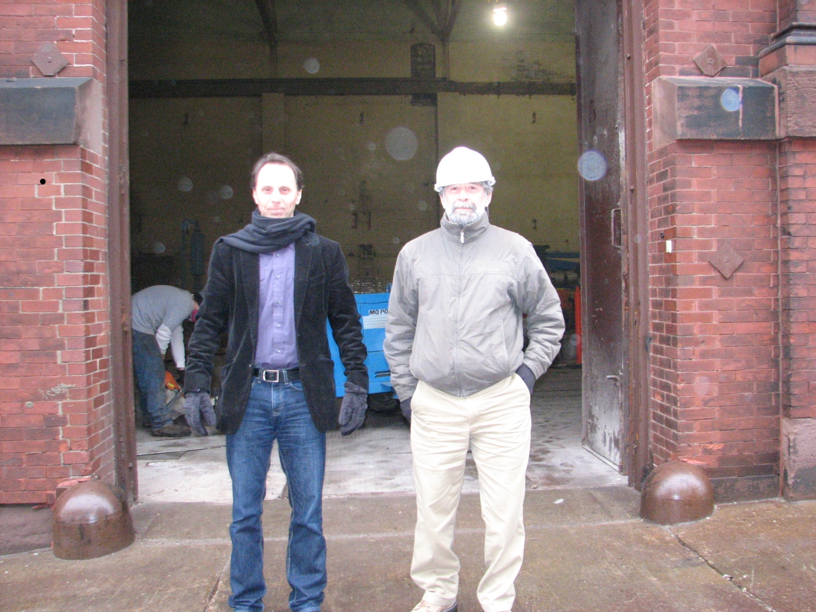 Philly Fringe President and Producing Director Nick Stuccio and Jeffrey M. Brown Associatiates Superintendent Greg Buzzard stand outside what will be the front door.