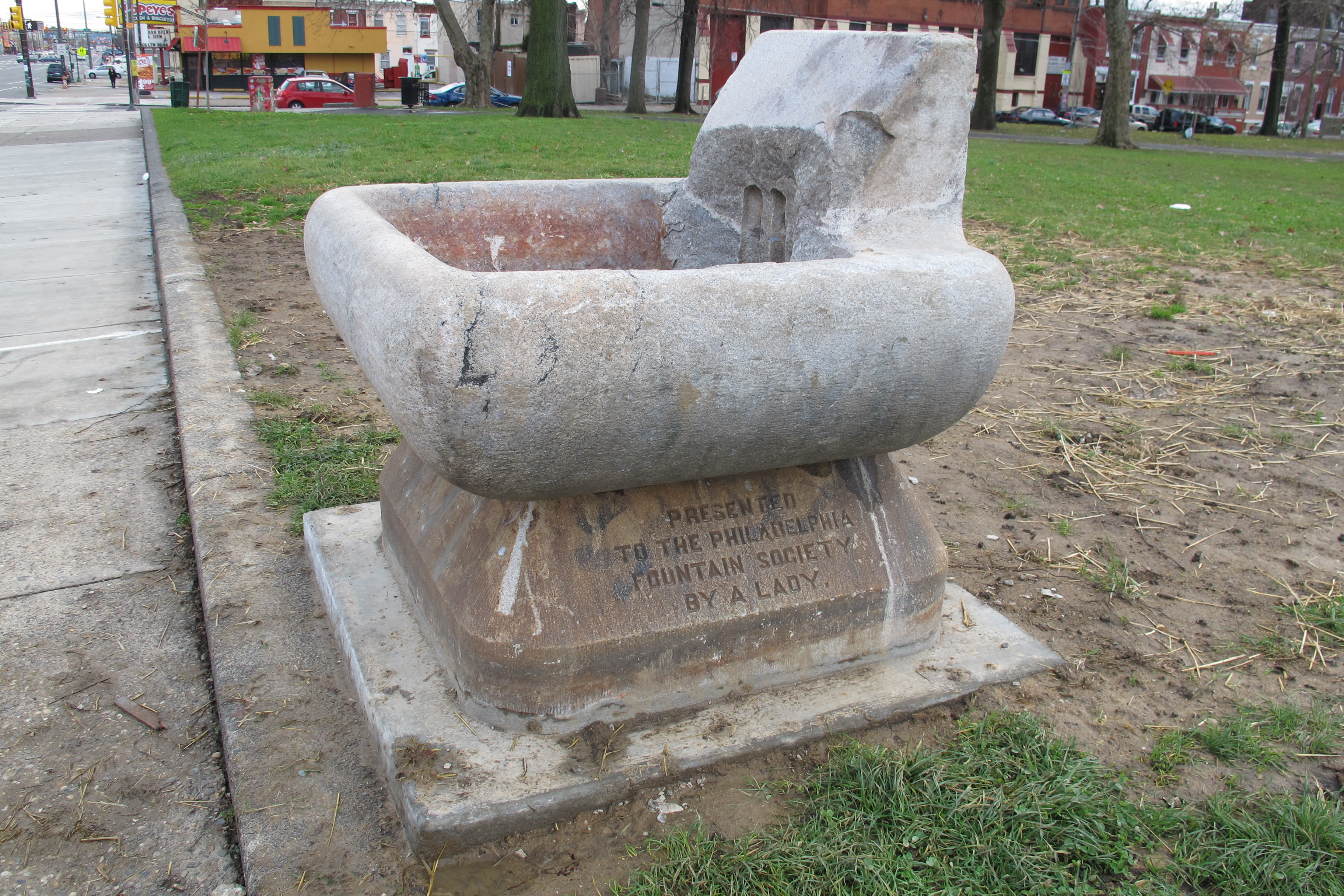 Presented to the Philadelphia Fountain Society by a Lady reads the inscription on this trough at the edge of Fairhill Square. One Mrs. Forpaugh donated funds in 1895 for this trough.