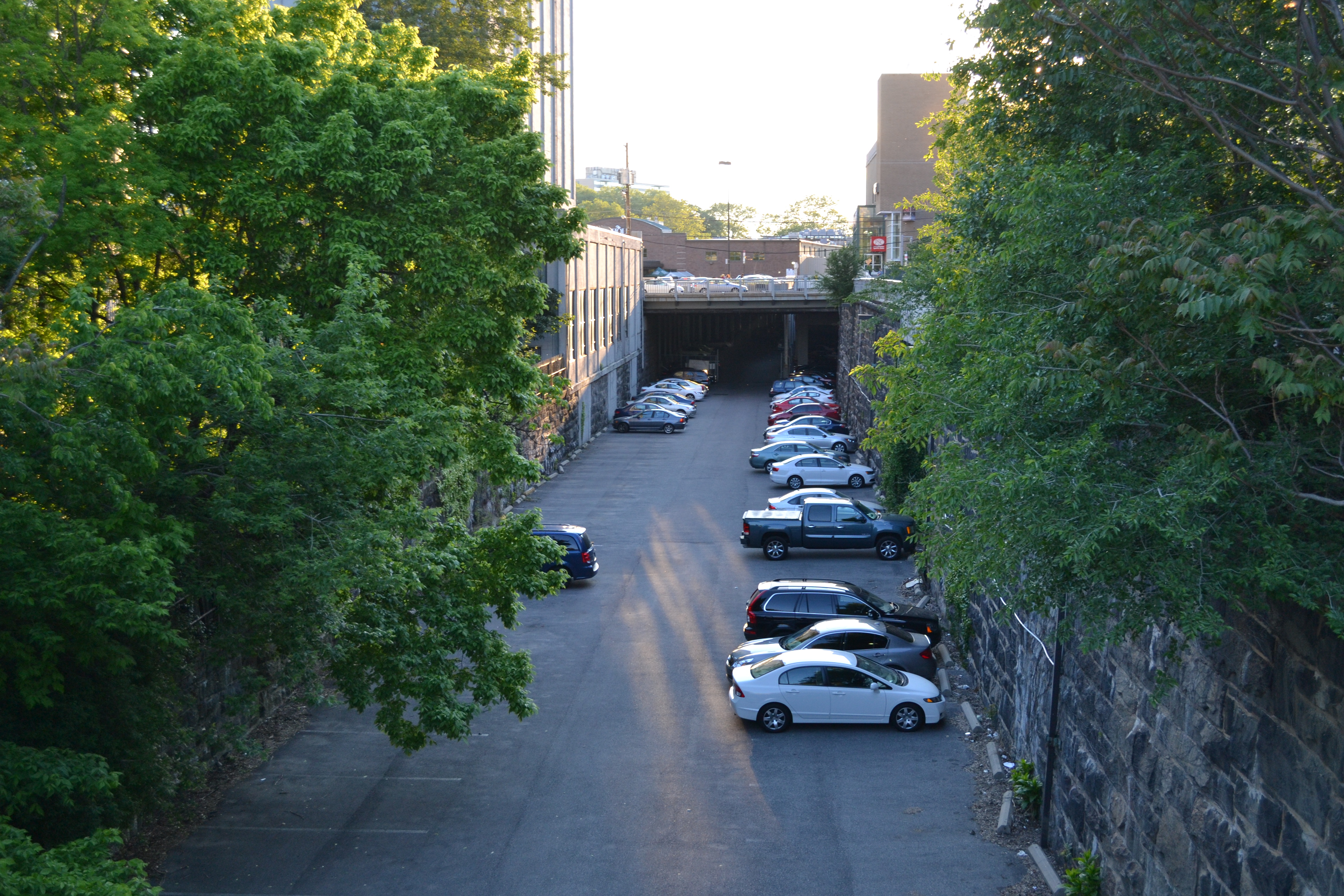 The former City Branch rail cut runs from Broad to 27th Street and portions are used for parking