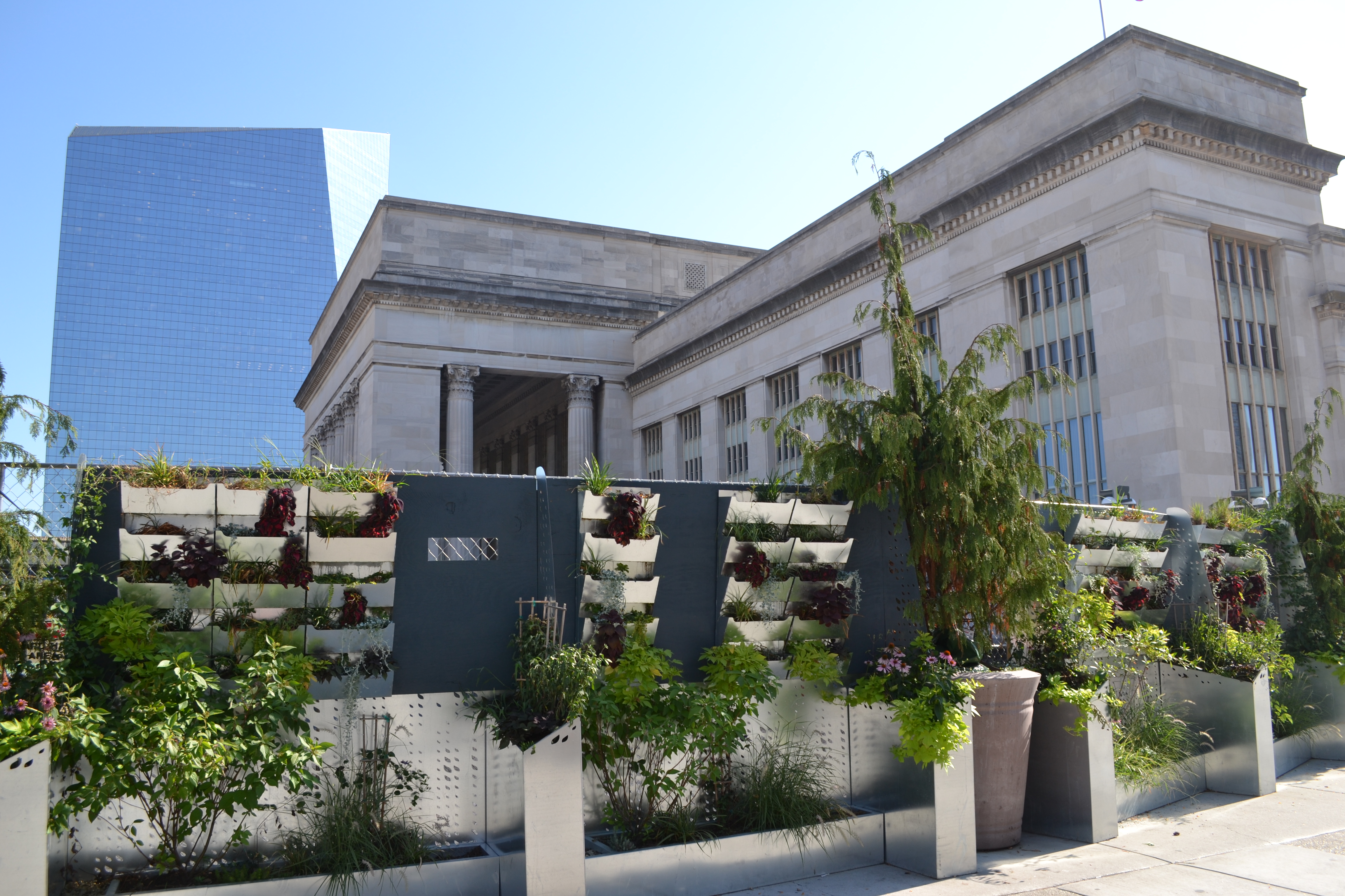 University City District installed green plant walls to cover construction site views at 30th Street Station's west entrance