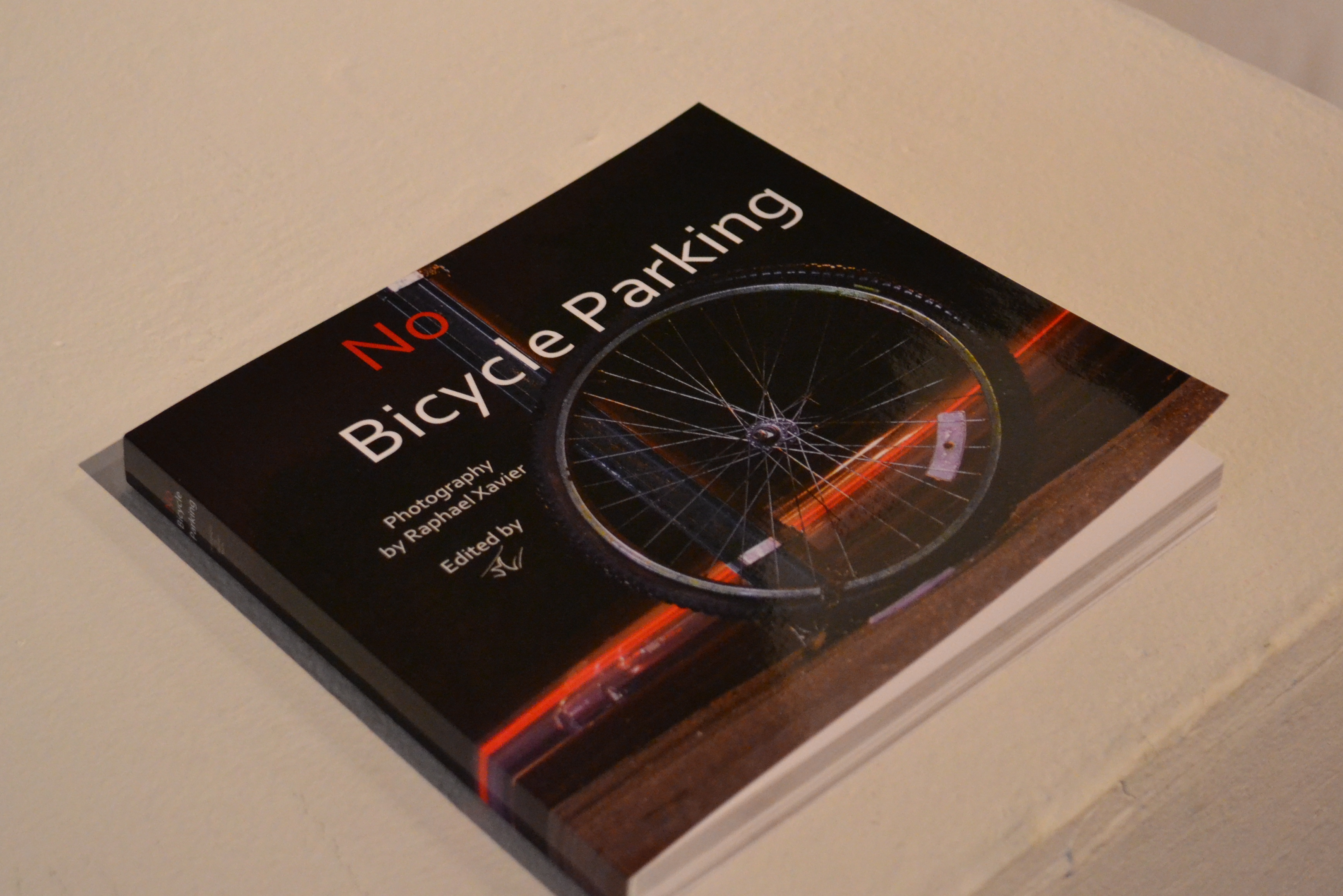 Xavier has printed a sample No Bicycle Parking book, but he plans to add more photos and personal stories