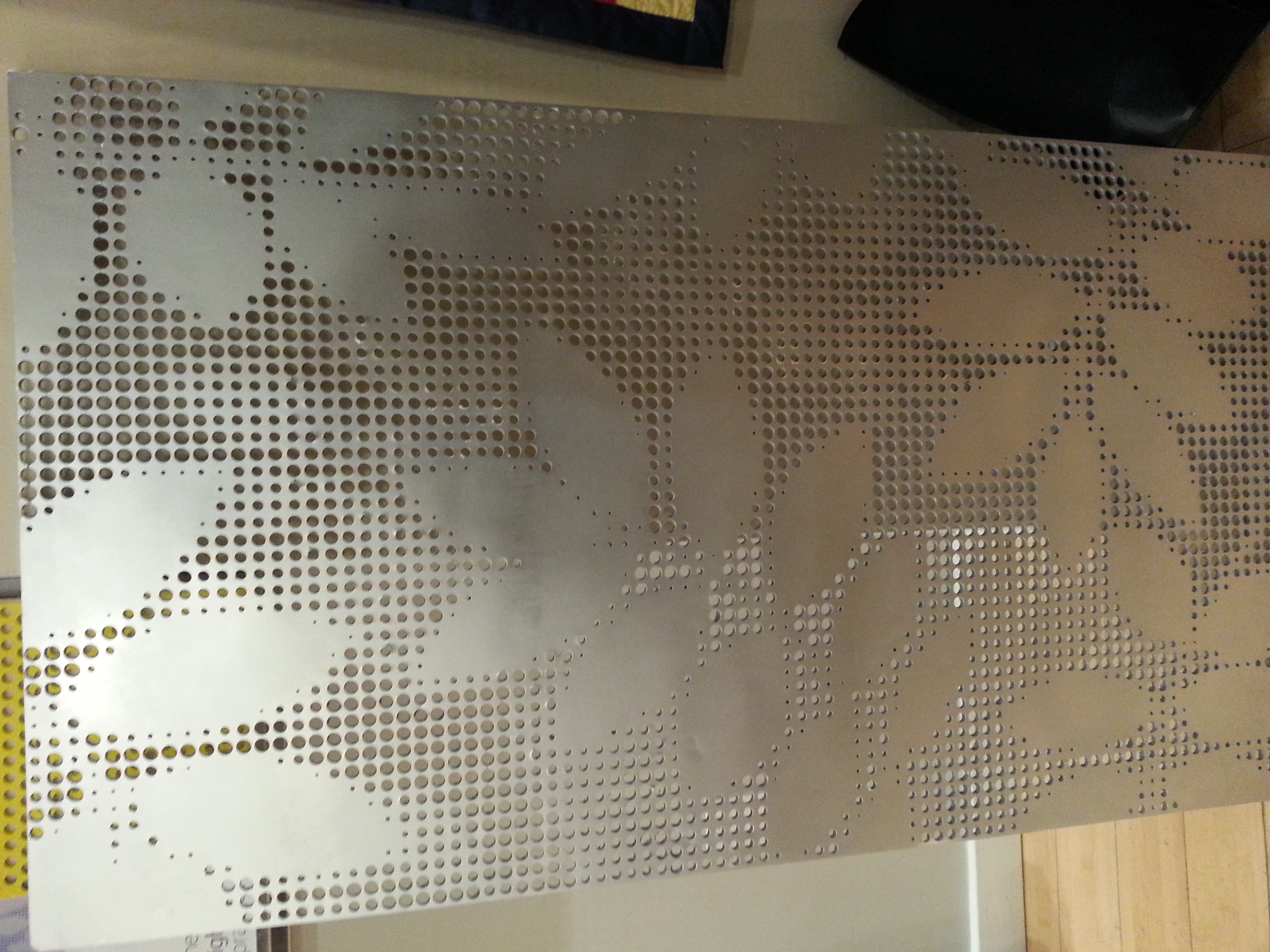 A mock-up of the water jet-cut screen