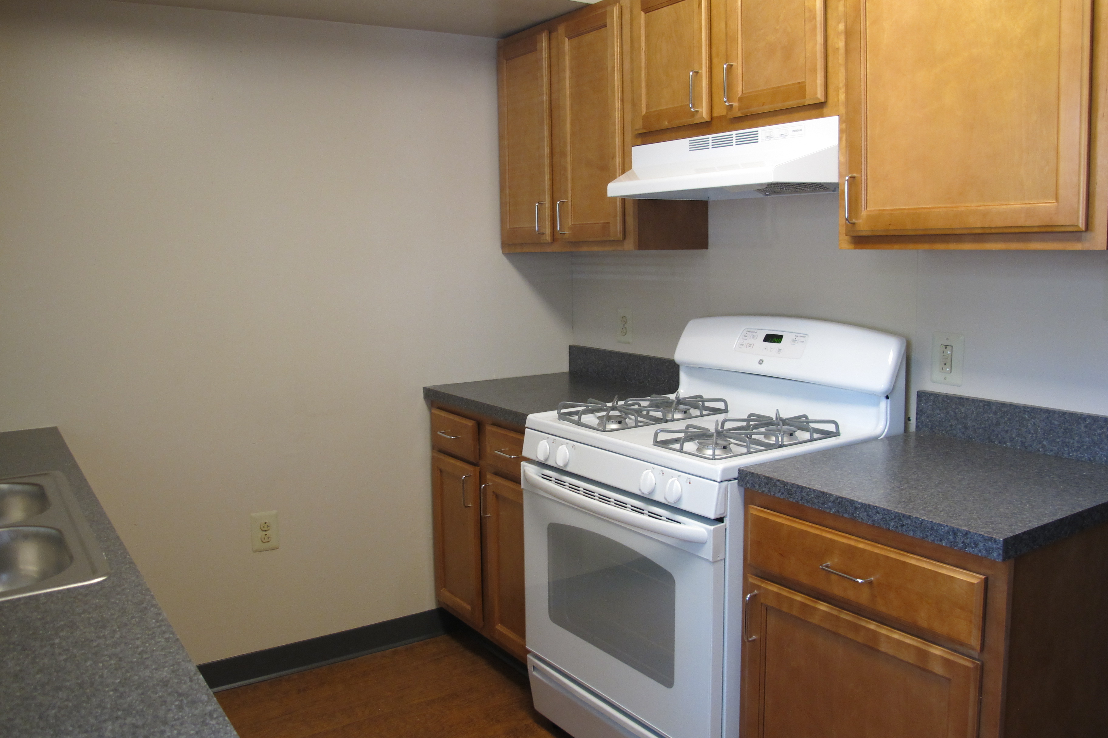 A refreshed kitchen in Villanueva, featuring new appliances, counters, and cabinets.