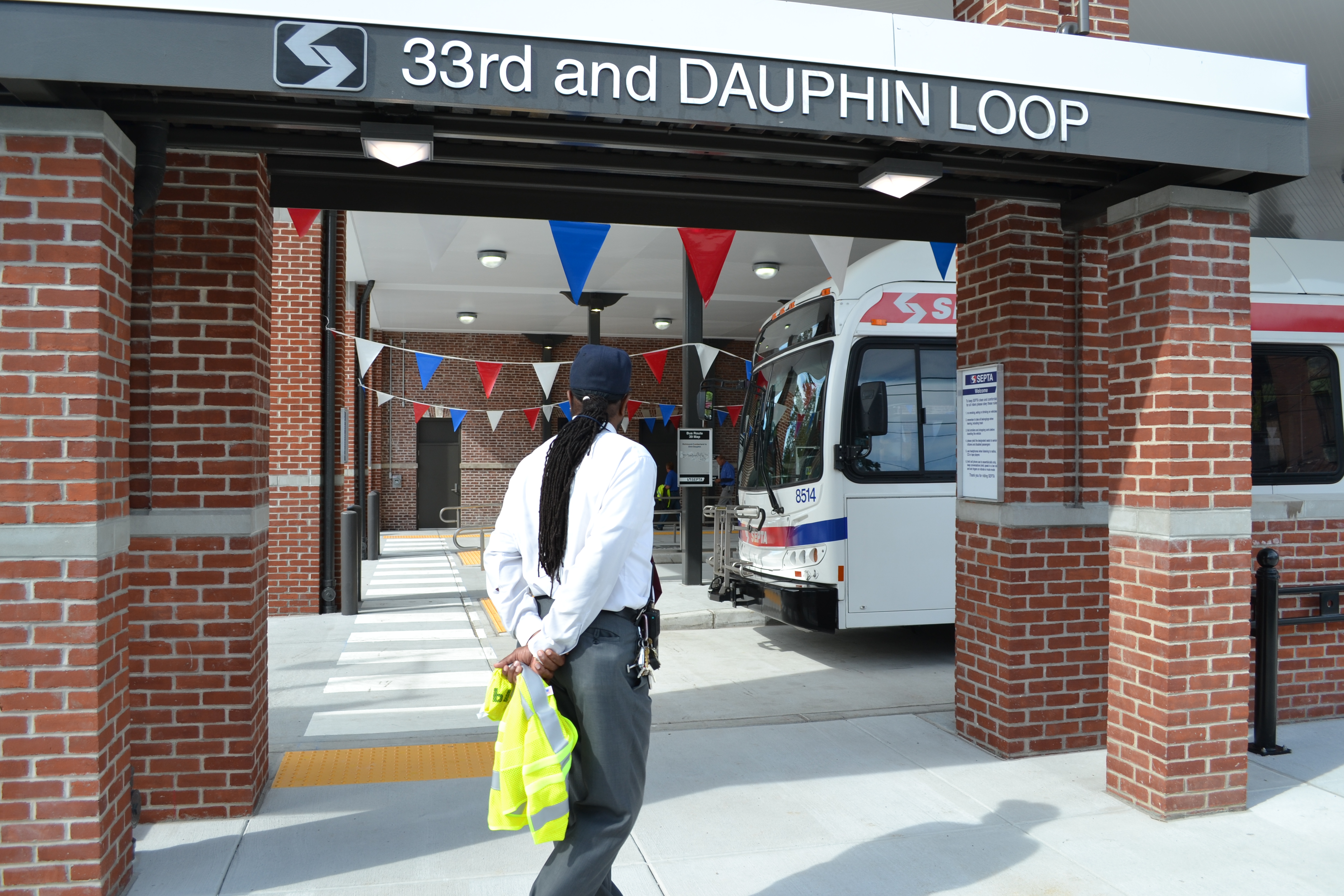 A SEPTA employee stood in a gateway into the bus loop