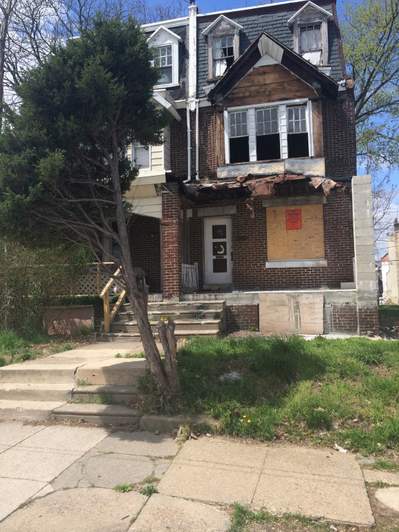 A vacant, damaged house in Logan