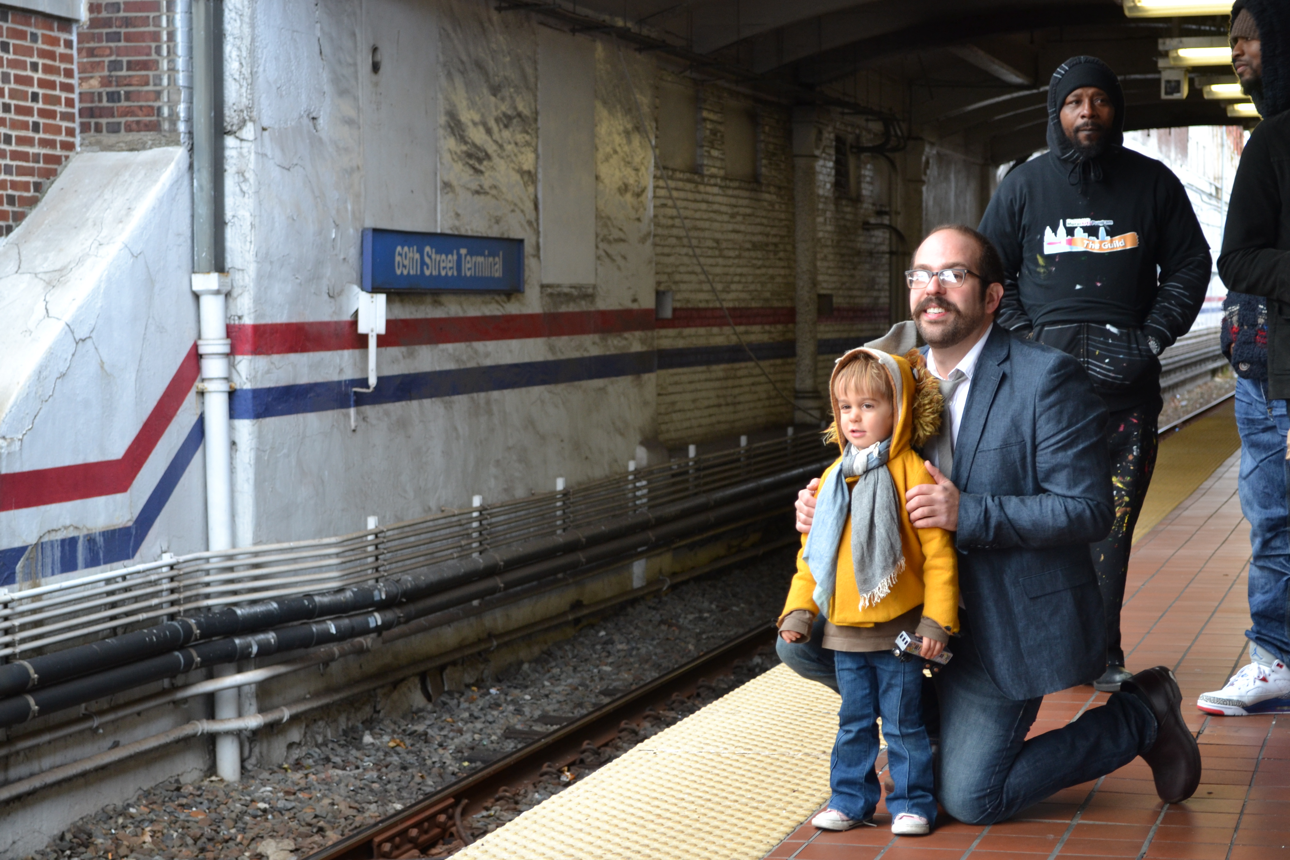 Artist Benjamin Volta and his son looked down the Market Frankford Line tracks