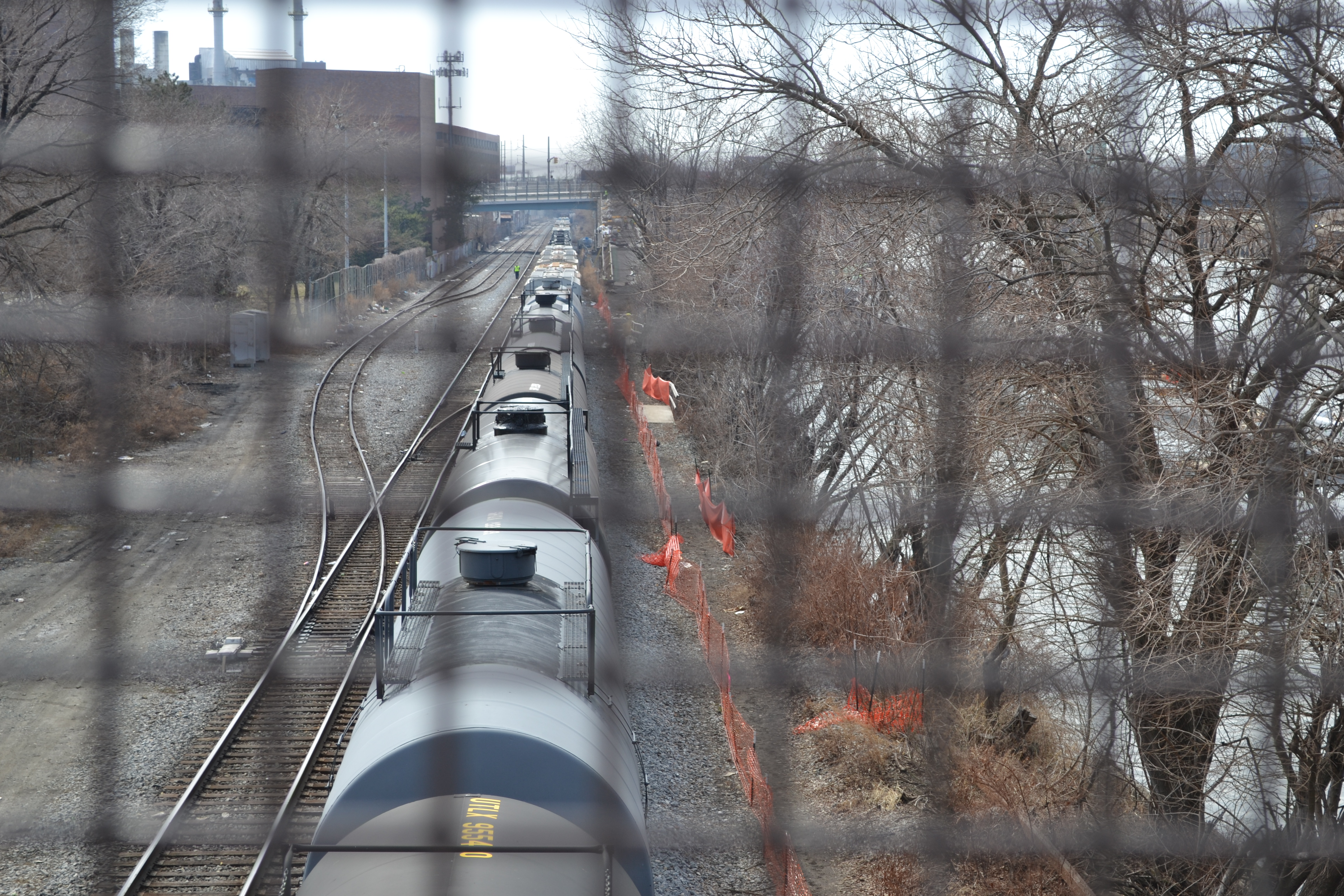 Freight cars stretch back as far as the eye can see on tracks along the Schuylkill River