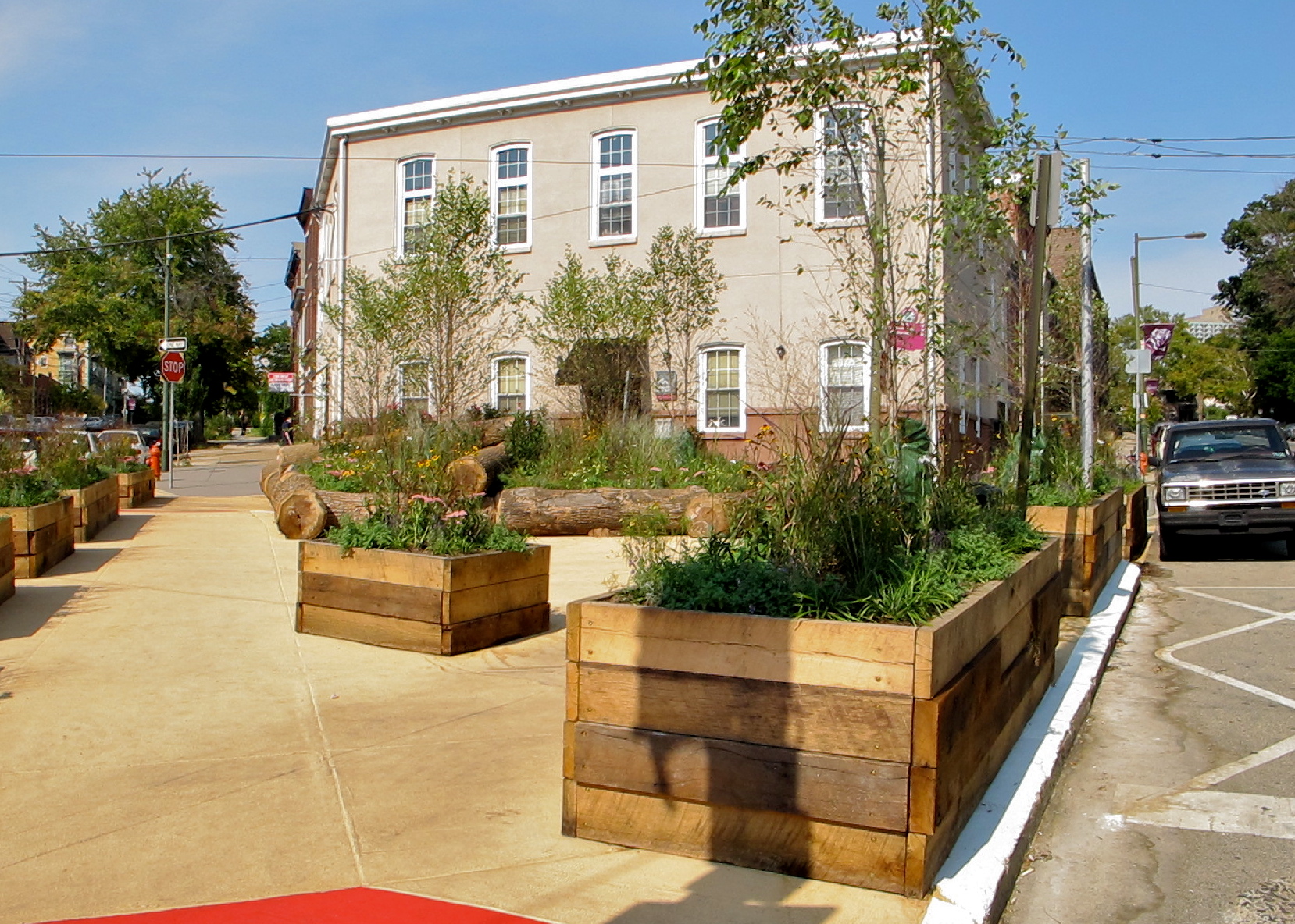 (Woodland Green's planters are partly constructed from salvaged wood joists from a house rehab in University City.)